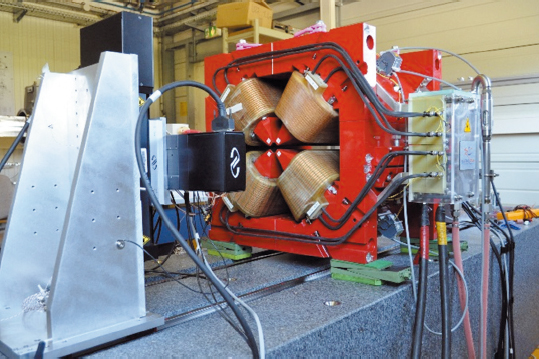 High gradient, 87 T/m quadrupole magnet under test on a magnetic measurement bench.